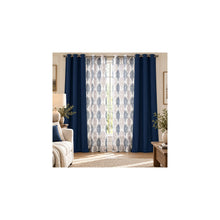 Navy room-darkening panels and coordinated damask sheers styled in a neutral living room