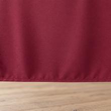 Burgundy tablecloth, fabric and hem closeup