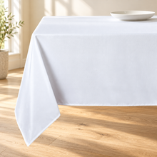 White tablecloth, neutral dining room corner lifestyle